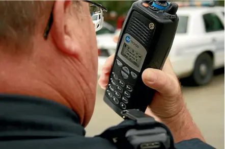  ??  ?? A Tait Communicat­ions digital radio is used by a policeman in the United States.