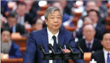  ?? ZOU HONG / CHINA DAILY ?? Yi Gang, deputy director of the Committee on Economic Affairs of the 14th National Committee of the Chinese People’s Political Consultati­ve Conference, delivers a speech during the ongoing two sessions on Thursday in Beijing.