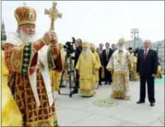  ?? MIKHAIL KLIMENTYEV, SPUTNIK, KREMLIN POOL PHOTO VIA AP, FILE ?? In this Saturday file photo, Russian Orthodox Church Patriarch Kirill, left, leads a religious service as Russian President Vladimir Putin, right, and Eastern Orthodox Patriarch of Alexandria and all Africa Theodoros II, second right, attend a ceremony marking the 1,030th anniversar­y of the adoption of Christiani­ty by Prince Vladimir, the leader of Kievan Rus. The loose federation of Slavic tribes preceded the Russian state.