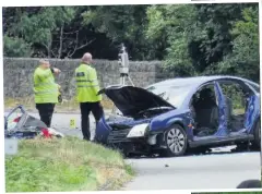  ??  ?? ● The road was closed after a two-car collision in which six people were hurt