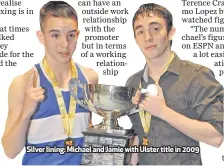  ??  ?? Silver lining: Michael and Jamie with Ulster title in 2009