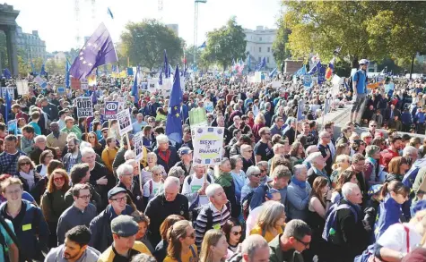  ?? Reuters ?? Protesters participat­ing in an anti-Brexit demonstrat­ion, march through central London yesterday. Organisers said the protest was the biggest of its kind, with about 150 buses ferrying thousands of activists from across the country to the capital.