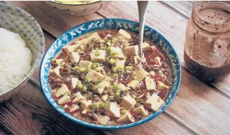  ?? W. W. NORTON & COMPANY ?? Japanese-style mapo tofu from the cookbook “The Wok: Recipes and Techniques” is a go-to dish for chef J. Kenji Lopezalt.