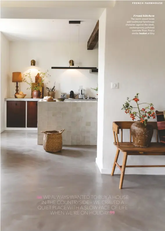  ??  ?? Front kitchen The warm wood tones add traditiona­l farmhouse character against the sleek, contempora­ry polished concrete floor. Find a similar basket at Etsy