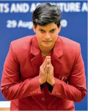  ??  ?? Above: Indian cricketer Deepti Sharma gestures as she accepts the Arjuna award on Saturday. Below: Sprinter Dutee Chand is all smiles after receiving her Arjuna.