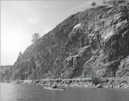  ?? J.P. SQUIRE/Special to The Okanagan Weekend ?? The Kalamalka Lake section of the Okanagan Rail Trail is the most spectacula­r with its high yellow cliffs, above, a tall, slender waterfall and endless lake views. The trail isn’t officially open year but only $150,000 is needed to wrap up a...