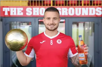  ??  ?? Mikey Drennan with the golden ball and his personalis­ed Irn Bru bottle. Pic: Carl Brennan.