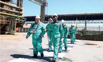  ?? ?? ▲ U.S. Deputy Treasury Secretary Wally Adeyemo walks with Sibanye Stillwater CEO Neal Froneman during his visit to a platinum mine as part of his five-day visit to the country, in Marikana, outside Rustenburg, northwest of Johannesbu­rg, South Africa.