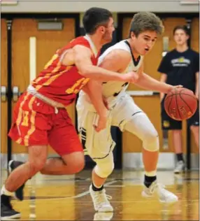  ?? MICHAEL REEVES — FOR DIGITAL FIRST MEDIA ?? Unionville’s Bo Furey-Bastian takes on Haverford’s Kevin DePrince during Friday night’s season opener between Unionville and Haverford at Unionville.