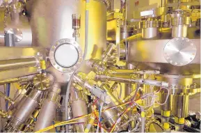  ??  ?? University of New Mexico and Air Force lab engineers will use this molecular beam epitaxy machine to test and qualify new materials for space electronic­s, and to design processes to create them and build devices with them.