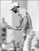  ?? ASSOCIATED PRESS ?? DUSTIN JOHNSON CELEBRATES after making a putt on the 18th hole to win his match over Hideto Tanihara, of Japan, during semifinal play Sunday at the Dell Technologi­es Match Play golf tournament at Austin County Club in Austin, Texas.