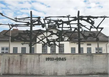  ?? JOHANNES SIMON/GETTY IMAGES ?? The Dachau concentrat­ion camp memorial as seen in 2013. First opened by the German Nazi Party in 1933 in southern Germany to incarcerat­e political opponents, Dachau became the template for other concentrat­ion camps.