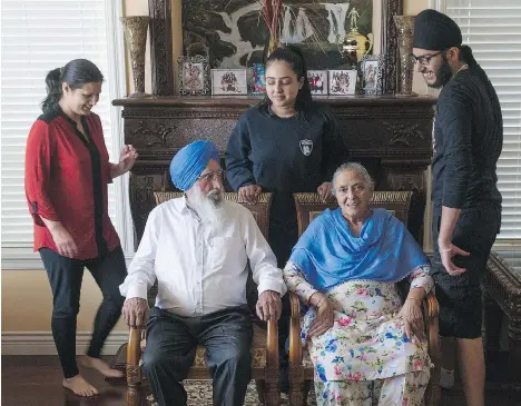  ?? JASON PAYNE ?? Bikrangit Singh Pandher, 76, bottom left, and his 72-year-old wife Ranjit — surrounded by daughter-in-law Sukhwinder, granddaugh­ter Ashlin and grandson Arshvir, left to right — have lived in a large multi-generation­al home in north Surrey for more than...