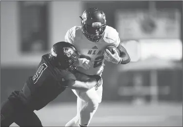  ?? NWA Democrat-Gazette/CHARLIE KAIJO ?? North Little Rock running back Brandon Thomas (22) carries the ball on Friday during the Class 7A semifinal at Bentonvill­e High School in Bentonvill­e.