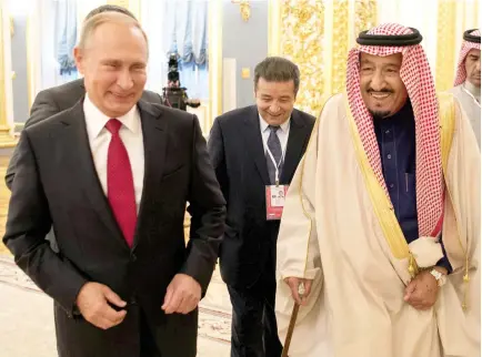  ??  ?? Saudi King Salman being received by Russian President Vladimir Putin at the Kremlin on Thursday. (SPA)