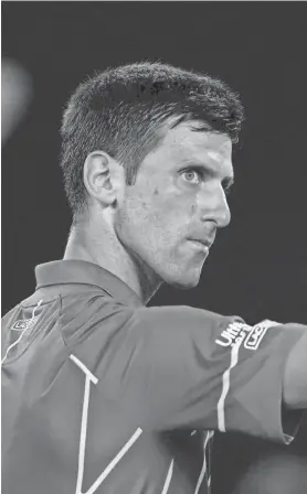  ?? AP ?? Novak Djokovic gestures as he celebrates a point win over Roger Federer during their Australian Open semifinal match Thursday.