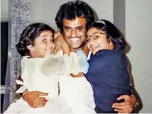  ?? ?? Rajinikant­h with his loving daughters then and now