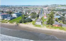  ??  ?? The site (top) could be redevelope­d for terraced homes, retirement living, a daycare, timeshare or new motel. Seen from the beach (above), the property at 387-391 Hibiscus Coast Highway is in four separate titles.