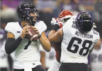  ?? Ronald Martinez / Getty Images ?? TCU quarterbac­k Kenny Hill looks to pass against Oklahoma in the Big 12 championsh­ip game. The Horned Frogs lost twice this season to the Sooners. They lost only one other time.