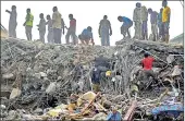  ?? Picture: EPA ?? Rescue workers search through rubble from the collapsed guesthouse at the Synagogue Church of All Nations of television evangelist TB Joshua in Lagos, Nigeria, in 2014.