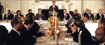  ?? PICTURE: TINA HAGER ?? President George W Bush hosts a Ramadaan dinner, for ambassador­s from Islamic nations.