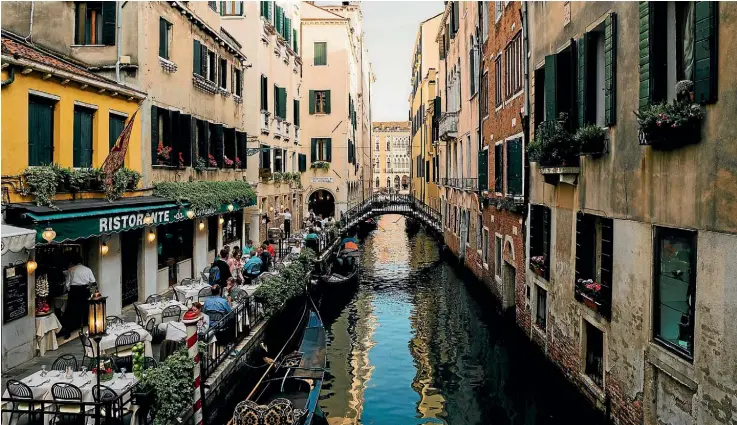  ??  ?? Built on 117 islands, Venice is separated by canals and connected by ramped bridges and a labyrinth of lanes.