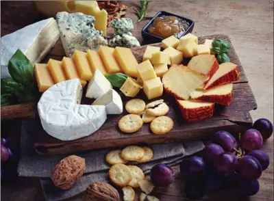  ?? GETTY IMAGES ?? “Right now, I’m crazy about long wooden cutting boards,” says writer Mary Garrity. A tray will artfully anchor all the individual serving pieces so they feel like one unit.