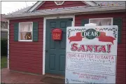  ?? DAN SOKIL — MEDIANEWS GROUP ?? A sign outside Lansdale’s Santa House, located adjacent to Railroad Plaza, encourages local kids to drop their letters to Santa in a mailbox on the door in lieu of visiting with Santa inside the house.