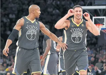  ?? KATHY WILLENS — ASSOCIATED PRESS ?? David West, left, and Klay Thompson react toward the Warriors bench during a game-changing run in the third quarter. Golden State was outplayed by the New York Knicks in the first half and trailed at halftime before rallying for the win.