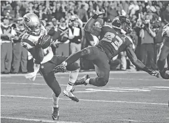  ?? Kathy Willens / Associated Press ?? The Patriots’ Malcolm Butler, left, etched his name into Super Bowl lore when he intercepte­d a pass meant for the Seahawks’ Ricardo Lockette to seal New England’s win in Super Bowl XLIX.