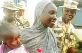  ?? PHOTO: ?? Chibok schoolgirl, Maryam Ali Maiyanga with her 10-month- old son, after the Nigerian military rescued her from a Boko Haram camp in Pulka axis of Gwoza Local Government Area of Borno State Army Headquarte­rs