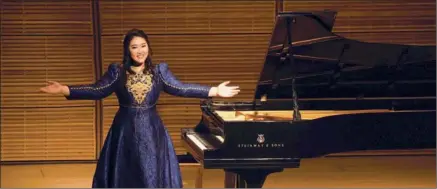  ?? PROVIDED TO CHINA DAILY ?? Beijing-based Steinway Artist Jiaxin Tian plays the piano on the stage.