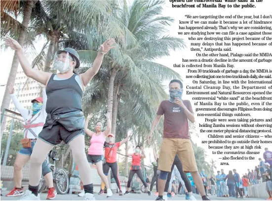  ?? PHOTOGRAPH BY BOB DUNGO JR. FOR THE DAILY TRIBUNE @tribunephl_bob ?? THE opening of the stretch of white sand beach along Roxas Boulevard this weekend saw the public trooping to Manila Bay for some exercise, such as these friends indulging in a Zumba workout.