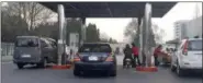  ?? THE ASSOCIATED PRESS FILE PHOTO ?? Cars line up at at a gas station in Pyongyang, North Korea.