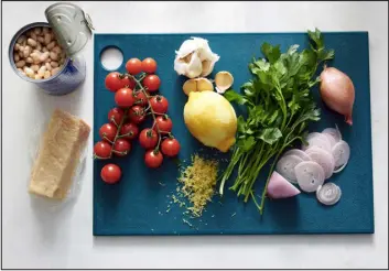  ?? ?? Ingredient­s for Lemony Pasta with Braised White Beans. Fresh herbs and cherry tomatoes round out this weeknight pasta recipe.