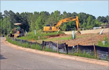  ?? Doug Walker ?? Utility infrastruc­ture is still being installed at the 91-home Berwick West subdivisio­n off Burnett Ferry Road.