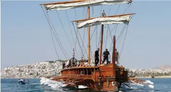  ?? THANASSIS STAVRaKIS/ THE ASSOCIATED PRESS ?? Visitors to Greece can row the Olympias, a reconstruc­tion of an ancient warship called a trireme.