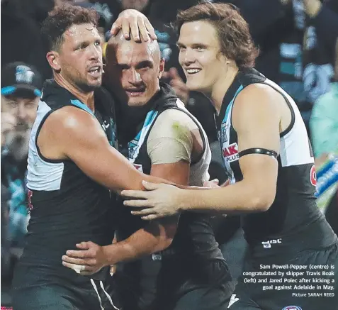  ?? Picture SARAH REED ?? Sam Powell-Pepper (centre) is congratula­ted by skipper Travis Boak (left) and Jared Polec after kicking a goal against Adelaide in May.