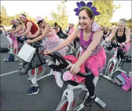  ?? Signal file photo ?? Leslie Payton, right, joins dozens of participan­ts at the annual Henry Mayo Ride for a Cure event, held in October at Santa Clarita Athletic Club in Newhall. Donations raised during the event go to support the Sheila R. Veloz Breast Center.