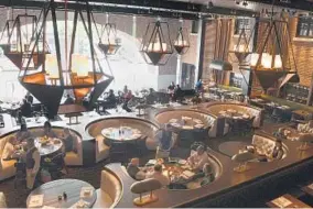  ?? BARBARA HADDOCK TAYLOR/BALTIMORE SUN PHOTOS ?? The dining room overlooks Thames Street at Rec Pier Chop House, the restaurant in the Sagamore Pendry Baltimore Hotel in Fells Point. Rating: ★★★★1/2 Where: 1715 Thames St., Sagamore Pendry Baltimore, Fells Point
443-552-1300,...