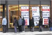  ?? NAM Y. HUH AP ?? People line up to take a COVID test Dec. 30 in Chicago, where schools will be closed today over virus concerns.