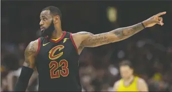  ?? The Associated Press ?? ON TO TORONTO: LeBron James talks with a teammate in the second half of the Cavaliers’ 105-101 win in Game 7 of their first-round playoff series against the Indiana Pacers in Cleveland. The Cavaliers advanced to the second round to face top-seeded...