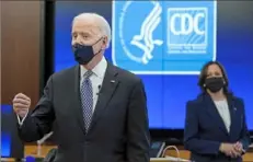  ?? Patrick Semansky/Associated Press ?? President Joe Biden speaks as Vice President Kamala Harris listens during a COVID-19 briefing at the headquarte­rs for the Centers for Disease Control and Prevention on March 19 in Atlanta.