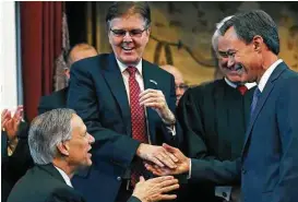  ?? Tom Reel / San Antonio Express-News file ?? Joe Straus, right, accepts congratula­tions from Gov. Greg Abbott and Lt. Gov. Dan Patrick, center, after being sworn in as speaker of the House during the opening of the 2015 Legislatur­e.