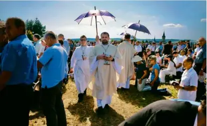  ?? BARTOSZ SIEDLIK/AFP VIA GETTY IMAGES ?? Poland’s political and religious leaders, as well as pilgrims from across the country, attended a Mass in Markowa on Sunday beatifying Jozef and Wiktoria Ulma and their young children.