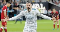  ?? SERGEI GRITS THE ASSOCIATED PRESS FILE PHOTO ?? In this May 26, 2018, photo Real Madrid’s Gareth Bale celebrates after scoring his side’s second goal during the Champions League final soccer match against Liverpool at the Olimpiyski­y Stadium in Kiev, Ukraine.