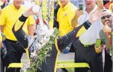  ?? MICHAEL CONROY/ASSOCIATED PRESS FILE ?? Simon Pagenaud pours milk on his head while celebratin­g his Indy 500 victory last year. Past champions of the race voted the milk tradition as the greatest in the event.