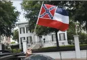  ?? ROGELIO V. SOLIS — THE ASSOCIATED PRESS, FILE ?? The Mississipp­i state flag, shown above on April 25, has in the canton portion of the banner the design of the Civil War-era Confederat­e battle flag that has been the center of a long-simmering debate about its removal or replacemen­t.