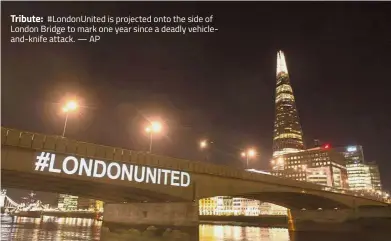  ?? — AP ?? Tribute: #LondonUnit­ed is projected onto the side of London Bridge to mark one year since a deadly vehicleand-knife attack.