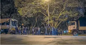  ?? AP ?? Police and military are stationed outside parliament in Harare as the counting of votes continues.